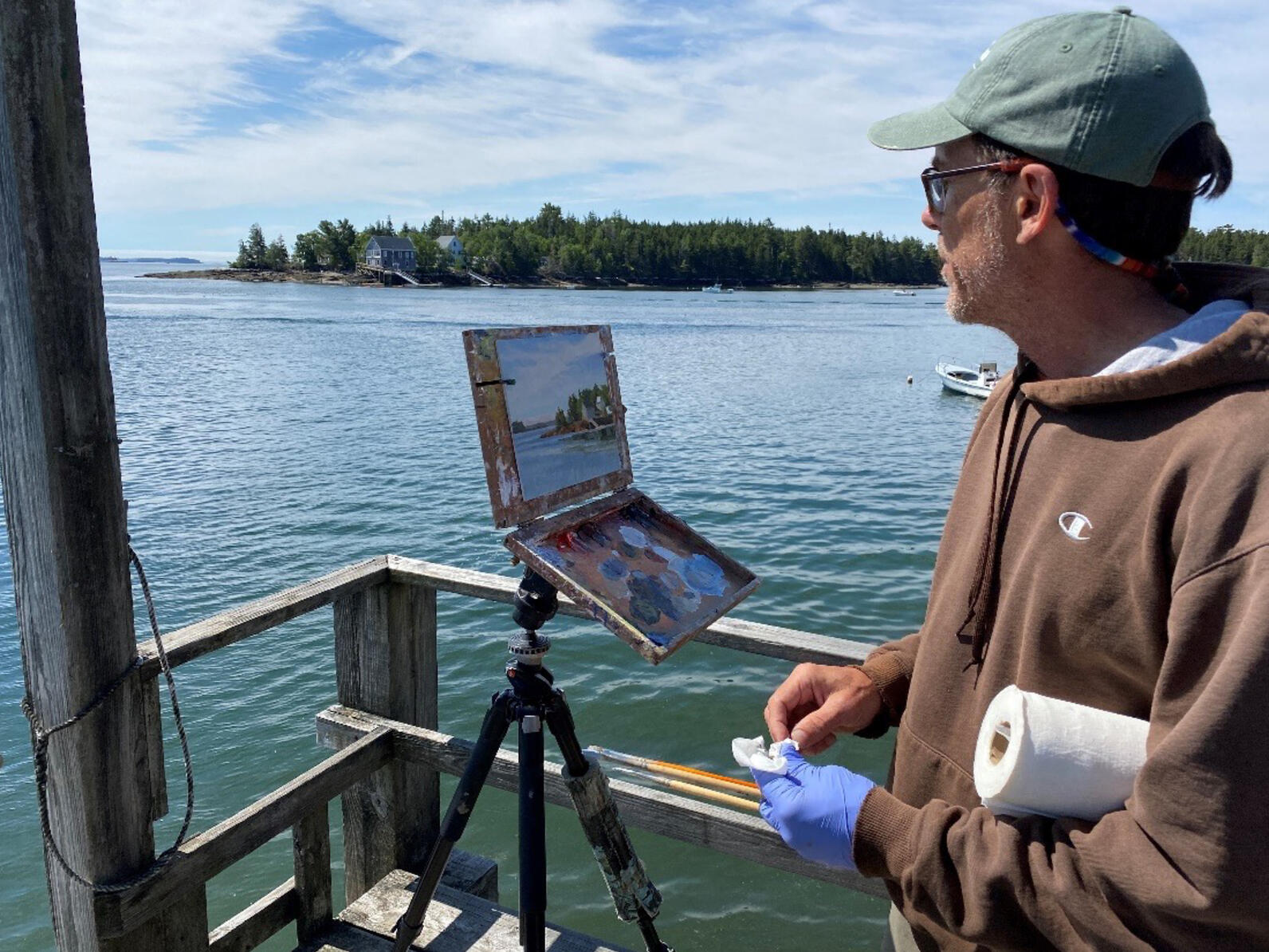 Jim Rataczak painting on the mainland dock
