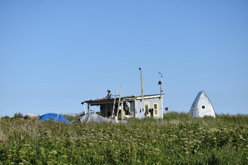 Egg Rock researcher relaxes itop the ”Egg Rock Hilton”.