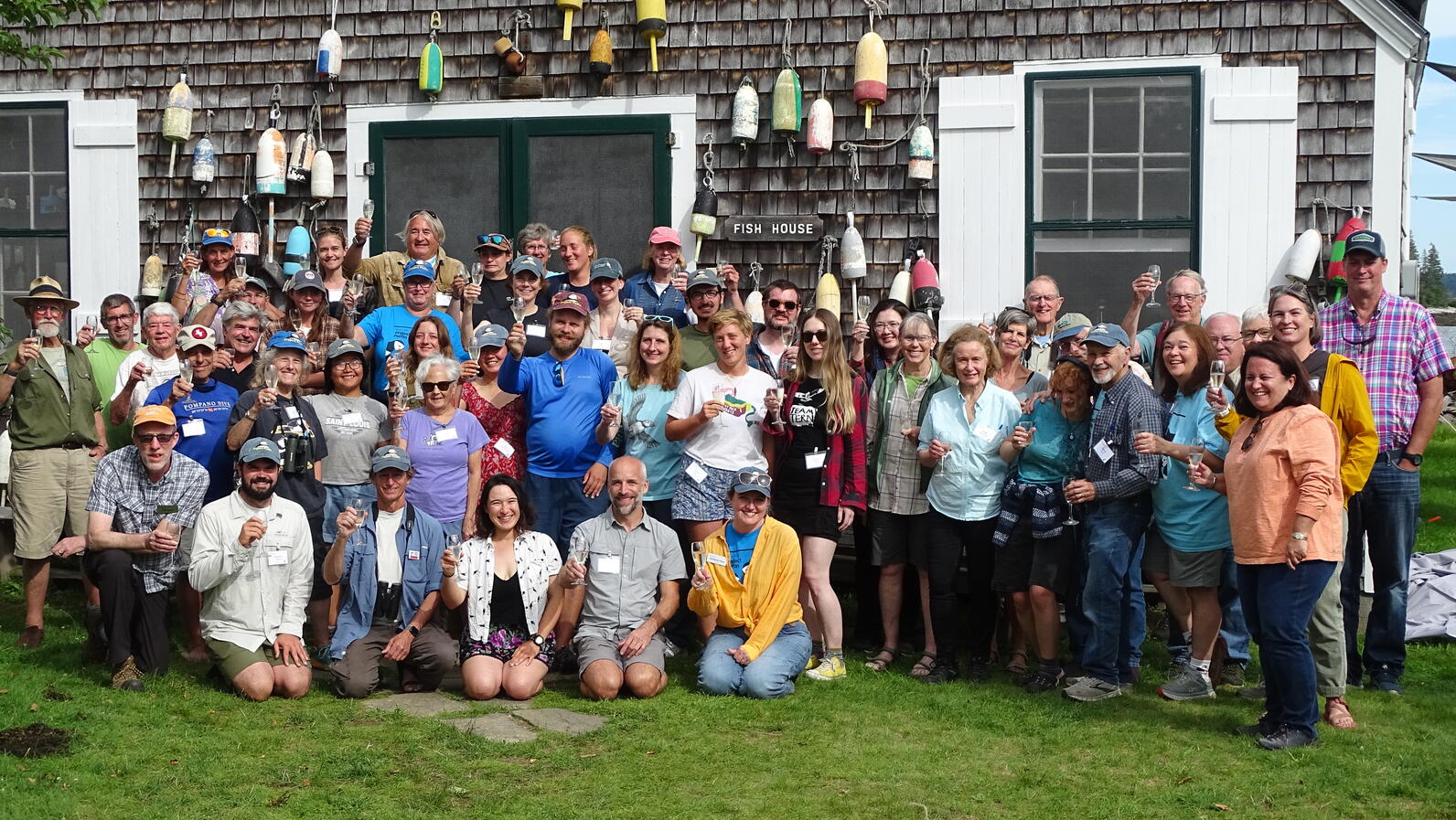 Cheers to 50 Years - Symposium participants toasting on Hog Island